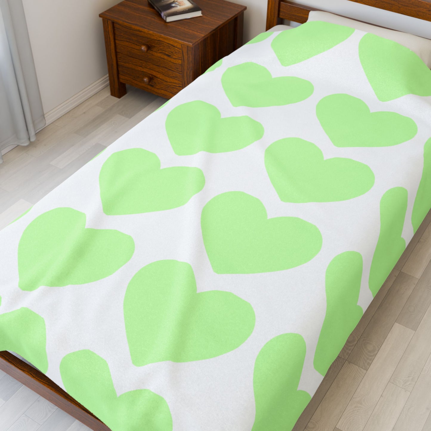 Close-up of plush texture and heart designs in soothing mint tones