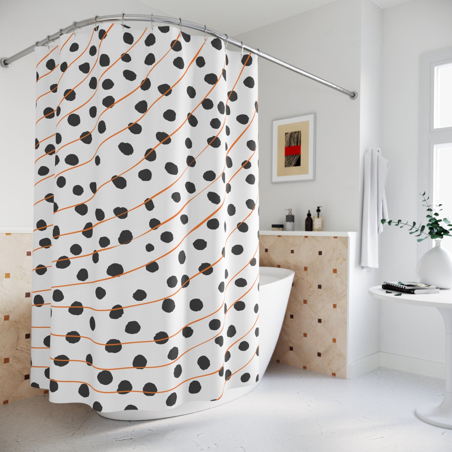 Styled bathroom scene with modern orange polka dot and striped shower curtain