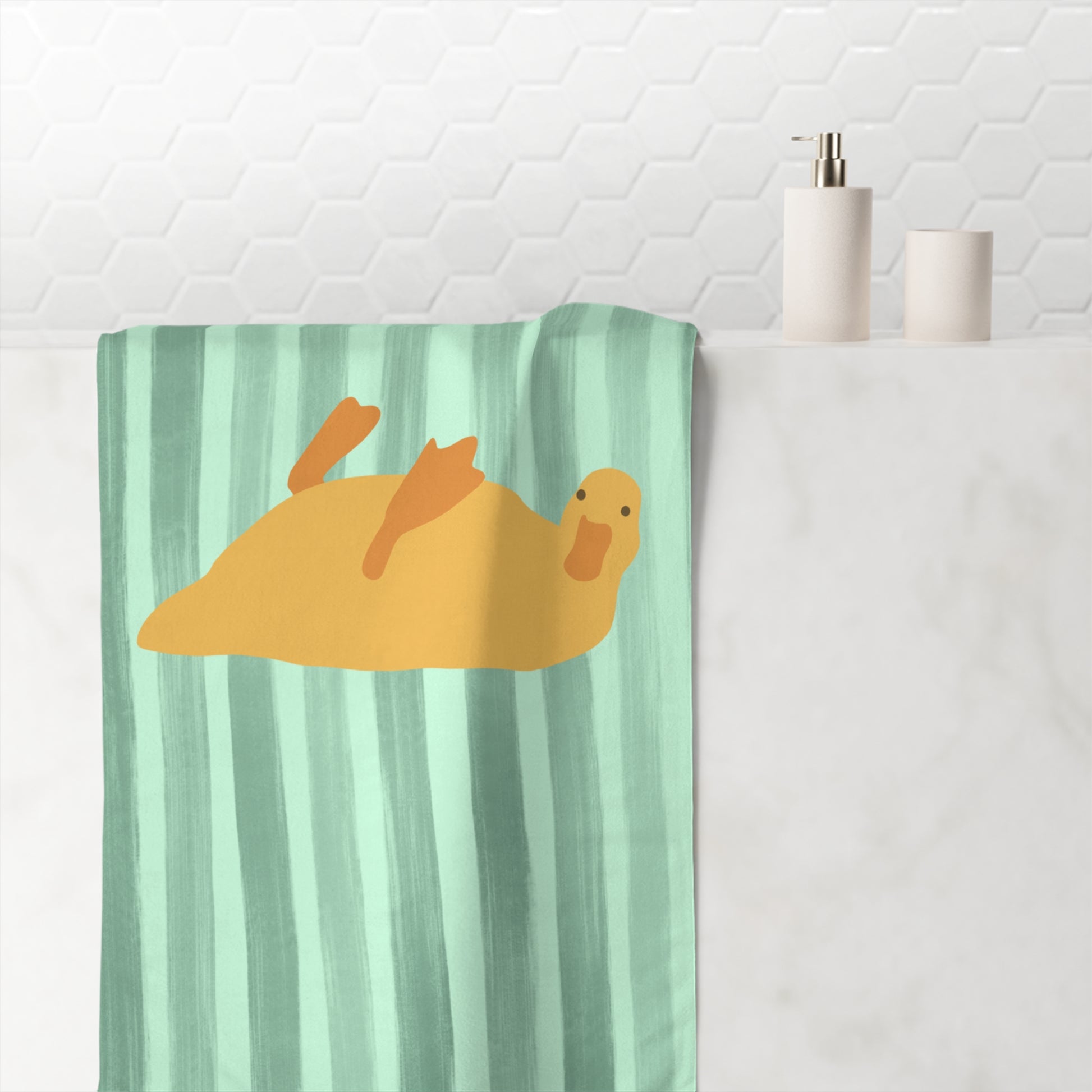 Funny towel with sleepy duck in bed rot position over bold green striped background – spirited and soft home accessory
