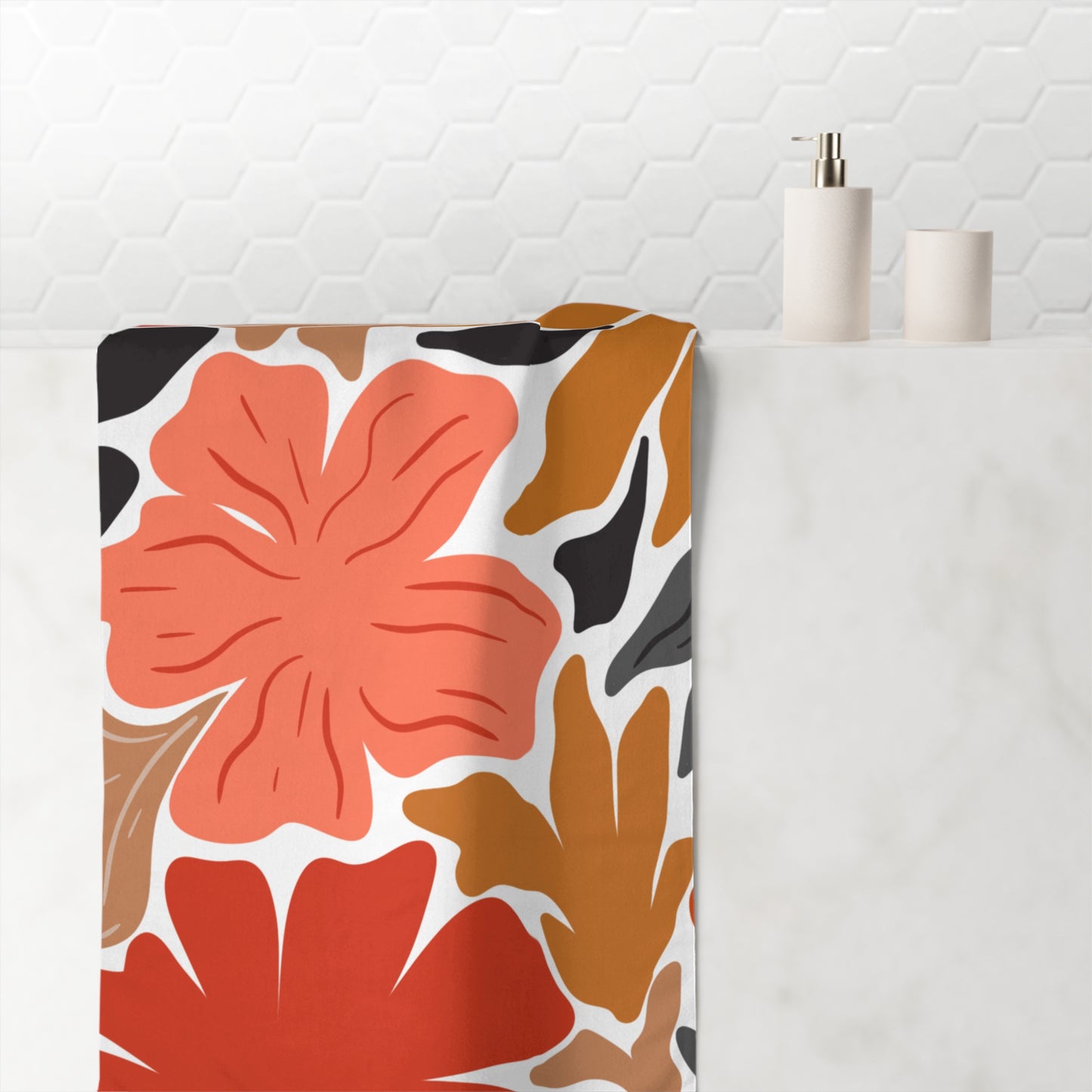 Close-up of floral design on orange and black towel