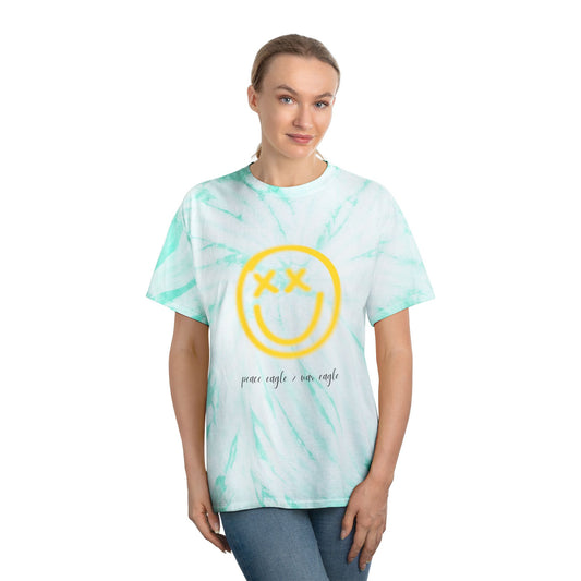 Green and yellow tie-dye tee with retro smiley face and “peace eagle > war eagle” message, styled for playful Oregon fans.