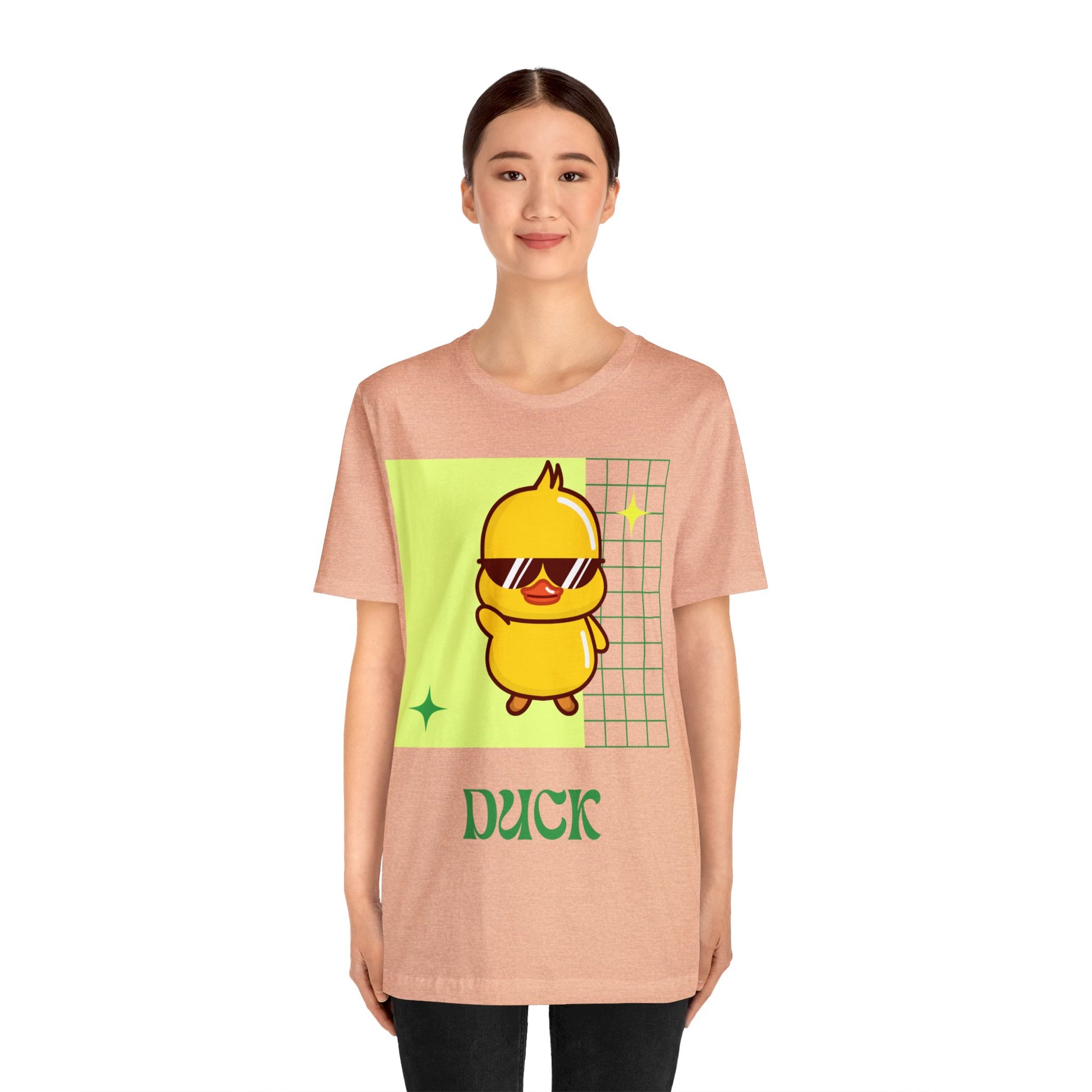 Peach Cute Duck Graphic T-Shirt featuring a warm, playful tone with bold fan-inspired details.