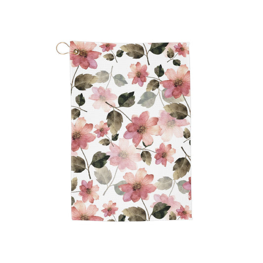 A soft yet lively pink garden-inspired golf towel showcasing a mix of delicate and vibrant florals—fresh, elegant, and effortlessly stylish.
