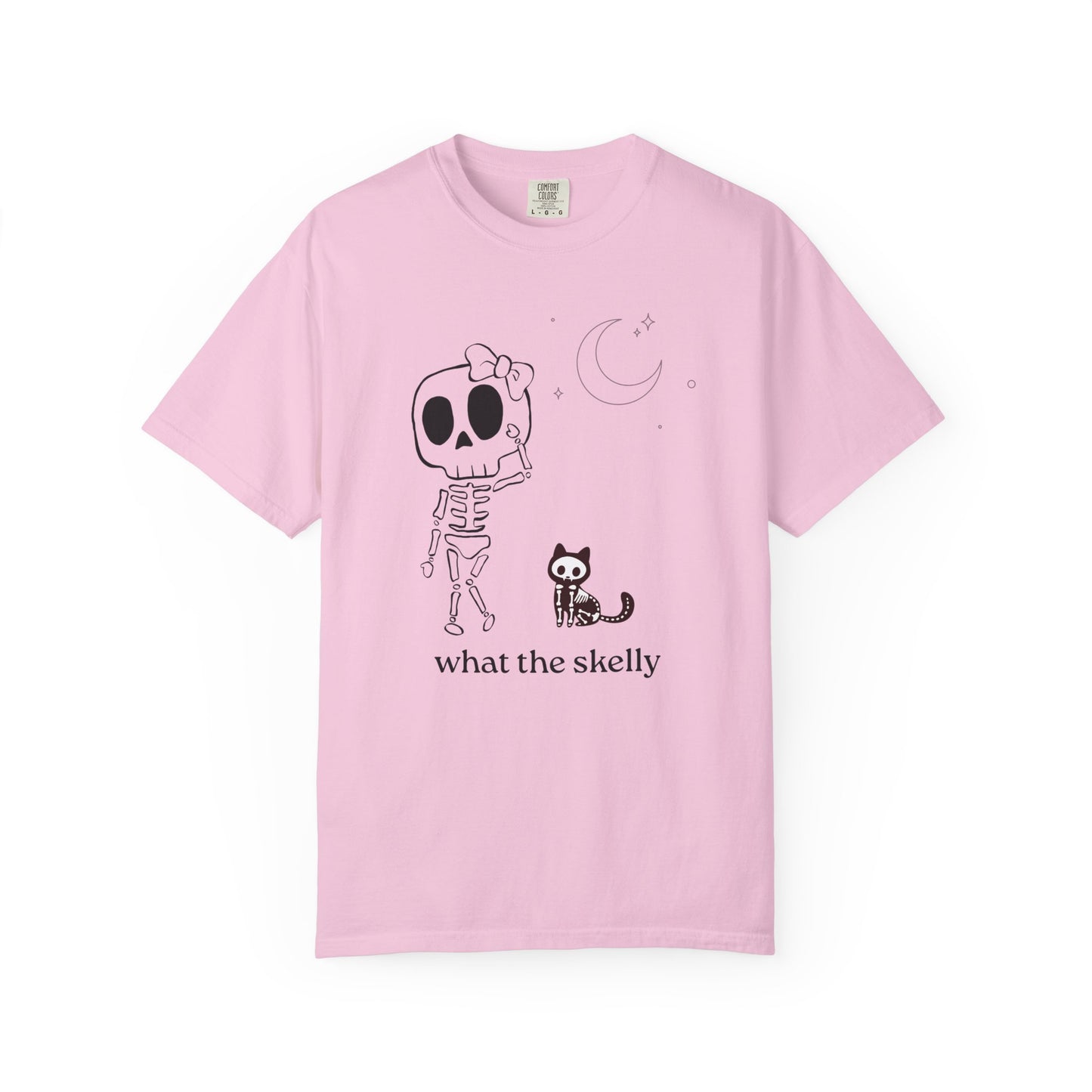 Pink tee with confused skeleton and curious cat illustration, styled for cozy fall fashion and Halloween fun.