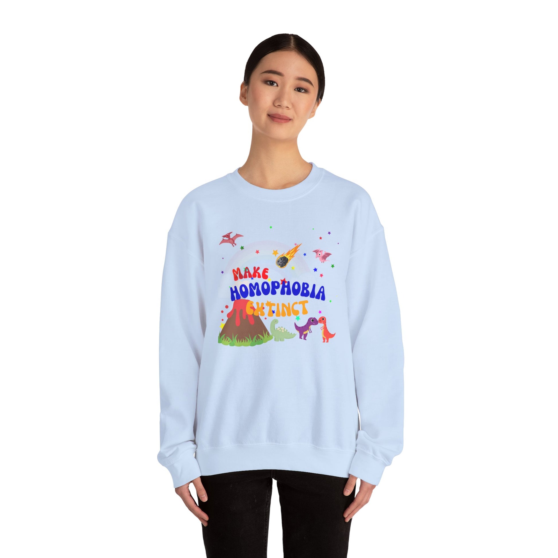 Pastel blue Pride sweatshirt with a charming dinosaur design and “Make Homophobia Extinct” slogan—stylish, expressive, and empowering.
