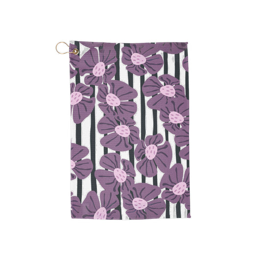 A floral-striped golf towel blending rich purple blooms with sleek, modern stripes—classic elegance meets bold retro vibes.