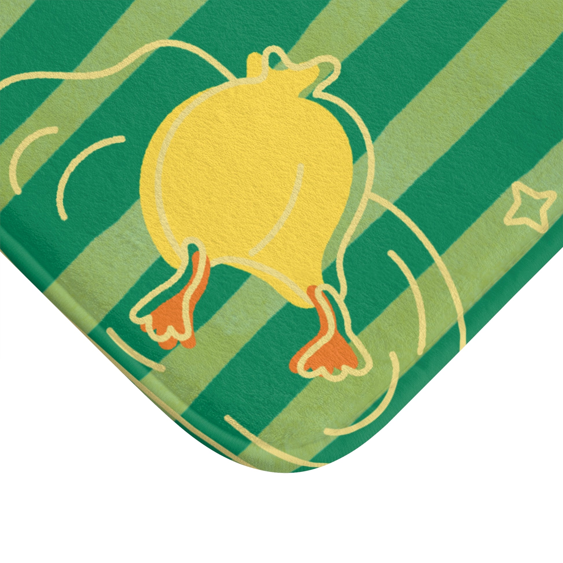 Close-up of plush bath mat with playful duck dive motif and bold stripes
