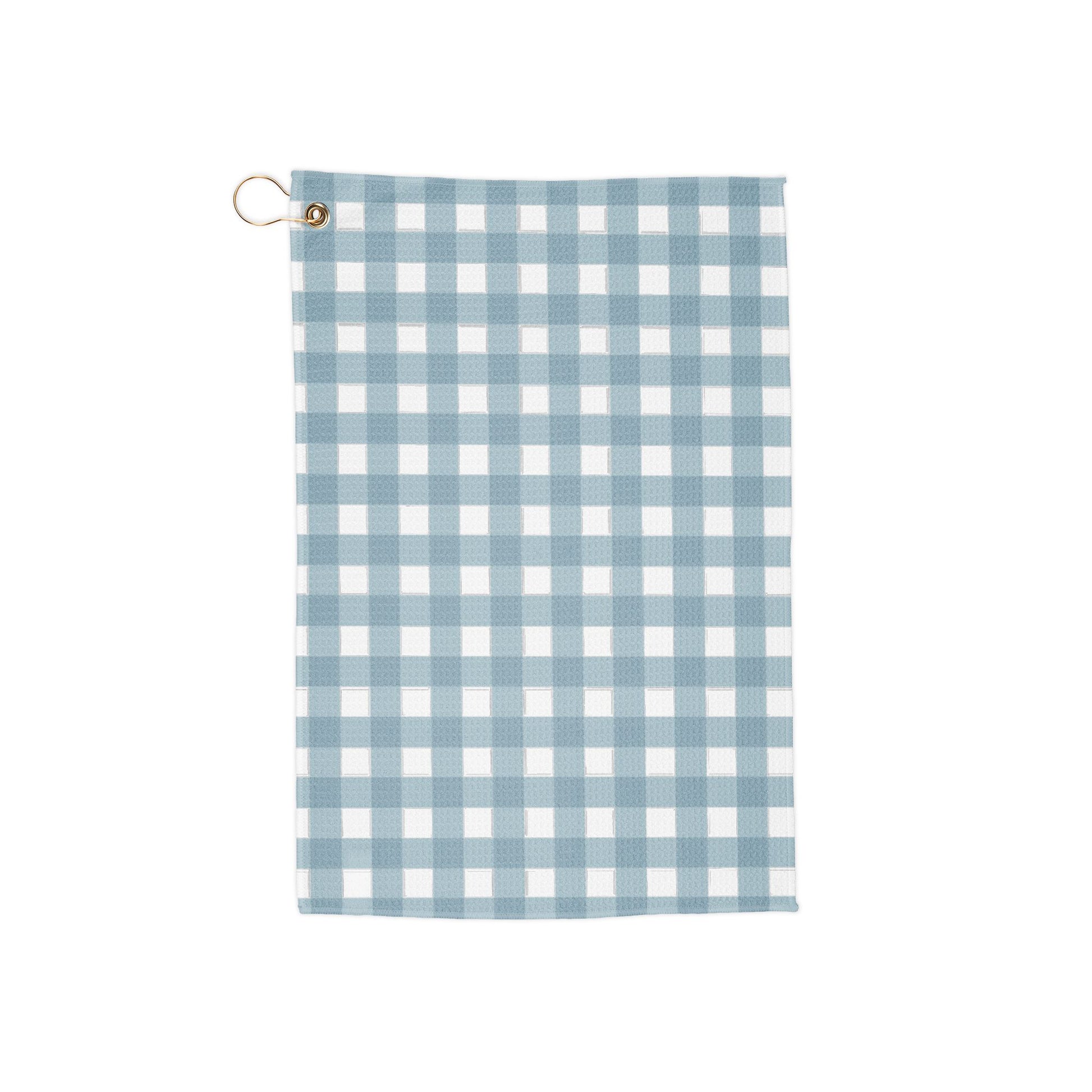 A soft sky blue gingham golf towel with breezy, fresh vibes. Light, airy, and perfect for a subtle yet stylish look on the course.