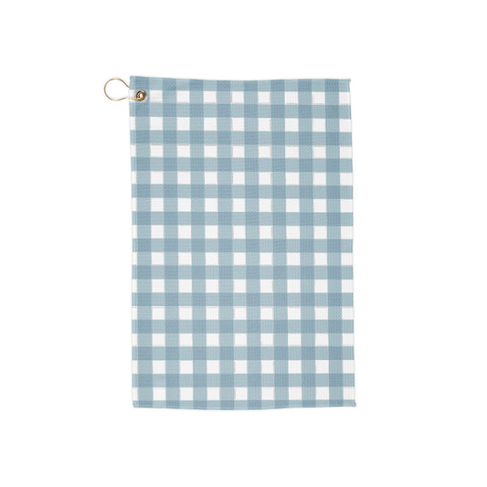 A soft sky blue gingham golf towel with breezy, fresh vibes. Light, airy, and perfect for a subtle yet stylish look on the course.