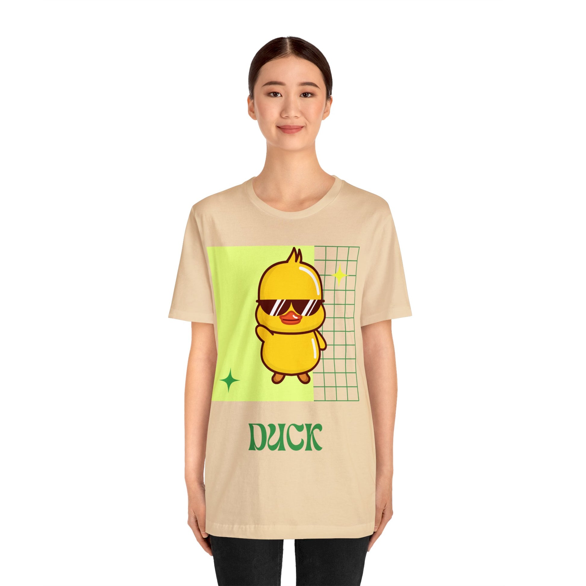 Soft Cream Cute Duck Graphic T-Shirt worn at a tailgate, blending neutral shades with school spirit.