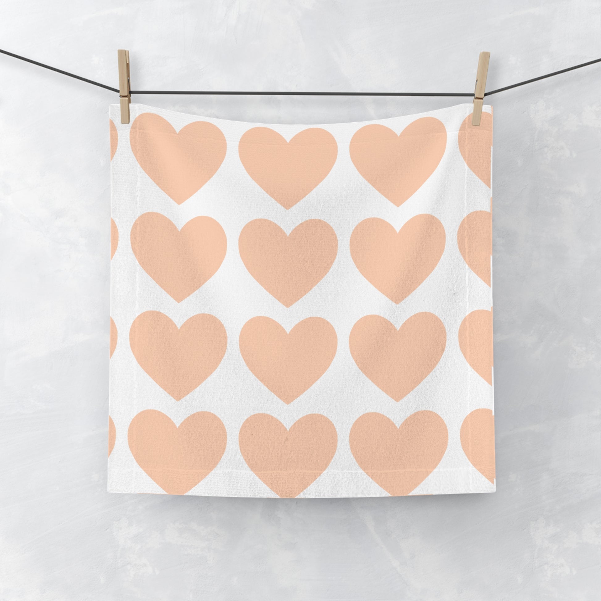 Close-up of plush microfiber texture and heart details on orange towe