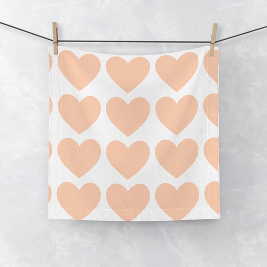 Close-up of plush microfiber texture and heart details on orange towe