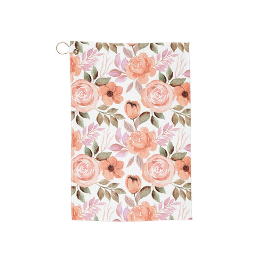 A soft pink floral golf towel with soft hues and a retro botanical design—perfect for players who love beautiful things. 