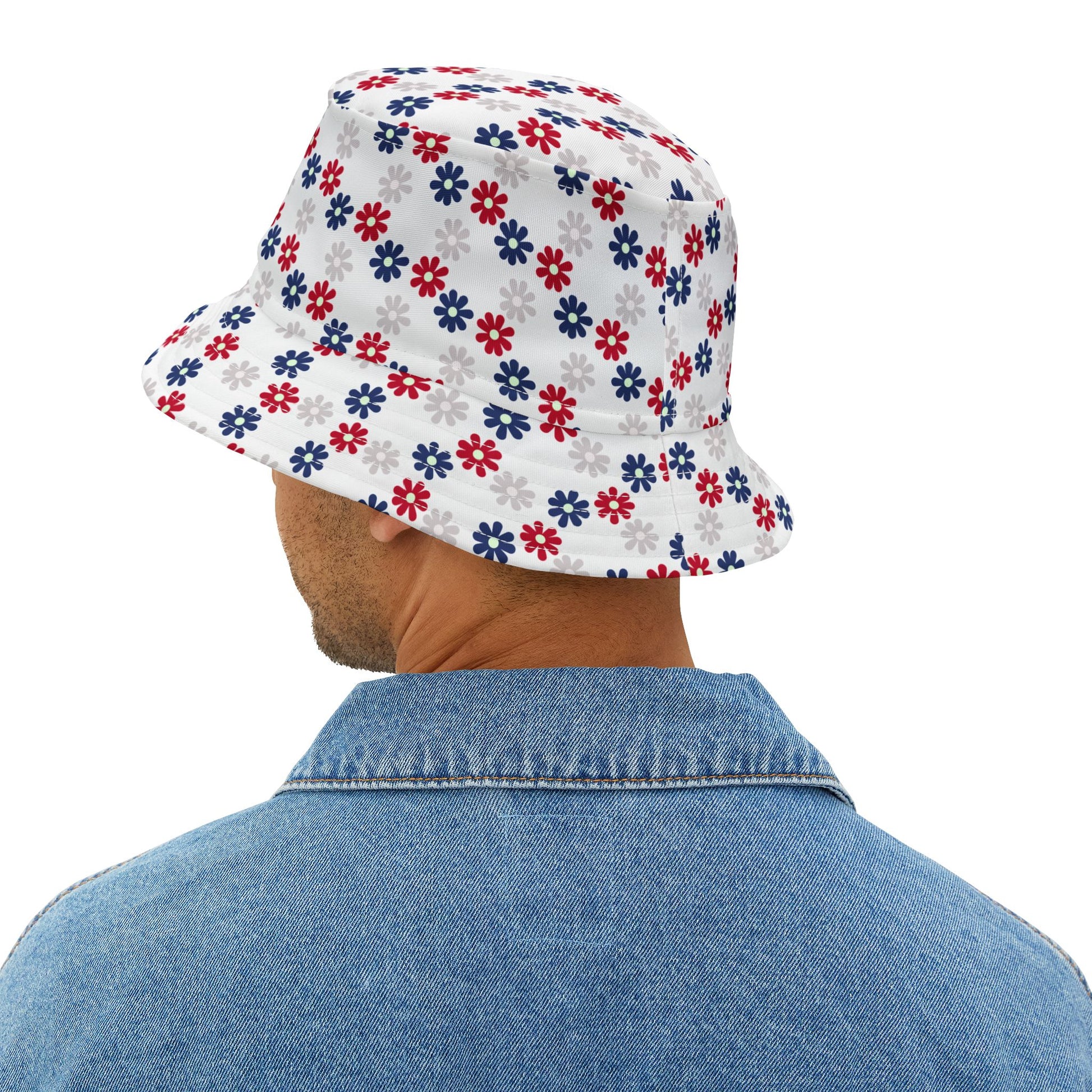 Trendy Fourth of July bucket hat featuring scattered red, white, and blue floral designs—playful, patriotic, and great for summer festivities