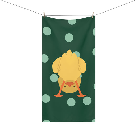 Bathroom towel featuring upside down duck on green polka dot pattern – quirky and playful home accessory with collegiate flair