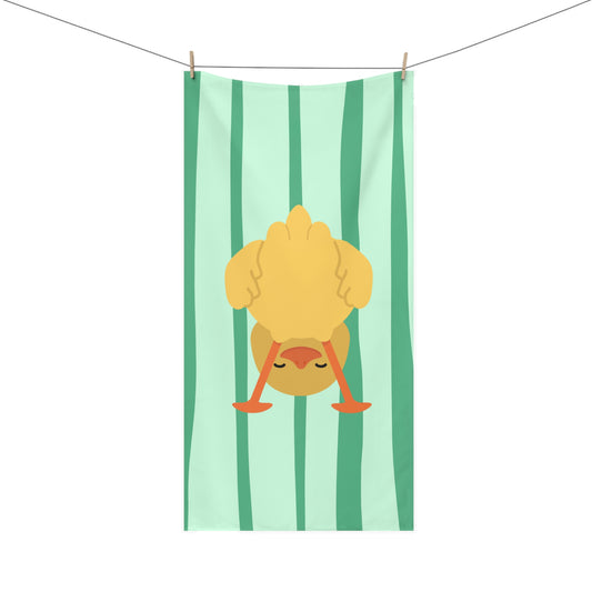 Bathroom towel with upside-down duck design over green stripes – quirky and playful decor for spirited homes