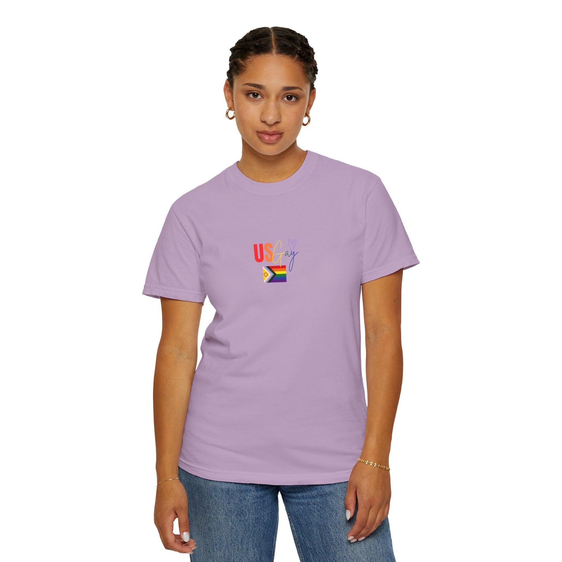 Soft lavender purple t-shirt featuring "US Gay" in bold rainbow lettering alongside a classic Pride flag, blending cozy comfort with a vibrant LGBTQ+ statement.