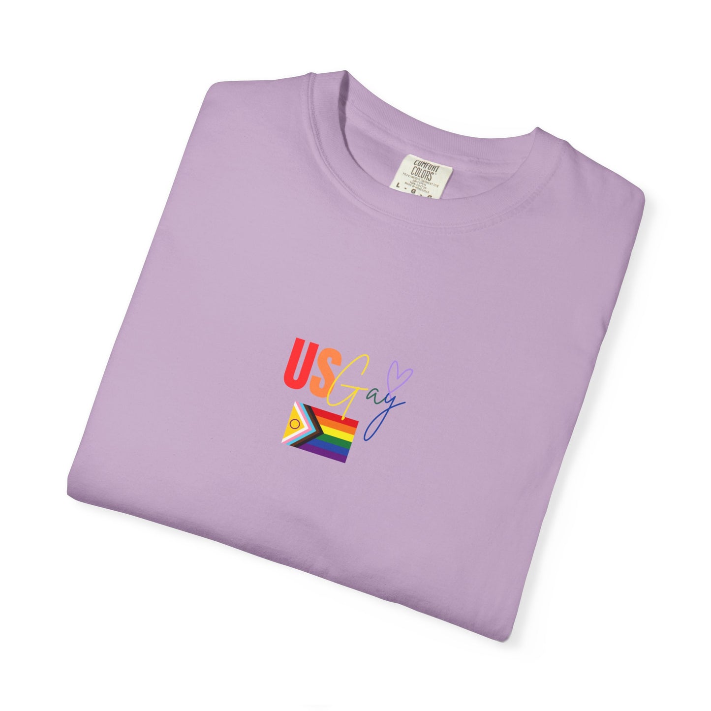 Playful "US Gay" lavender purple t-shirt with vibrant rainbow text and a pride flag, blending retro charm with unapologetic LGBTQ+ pride.