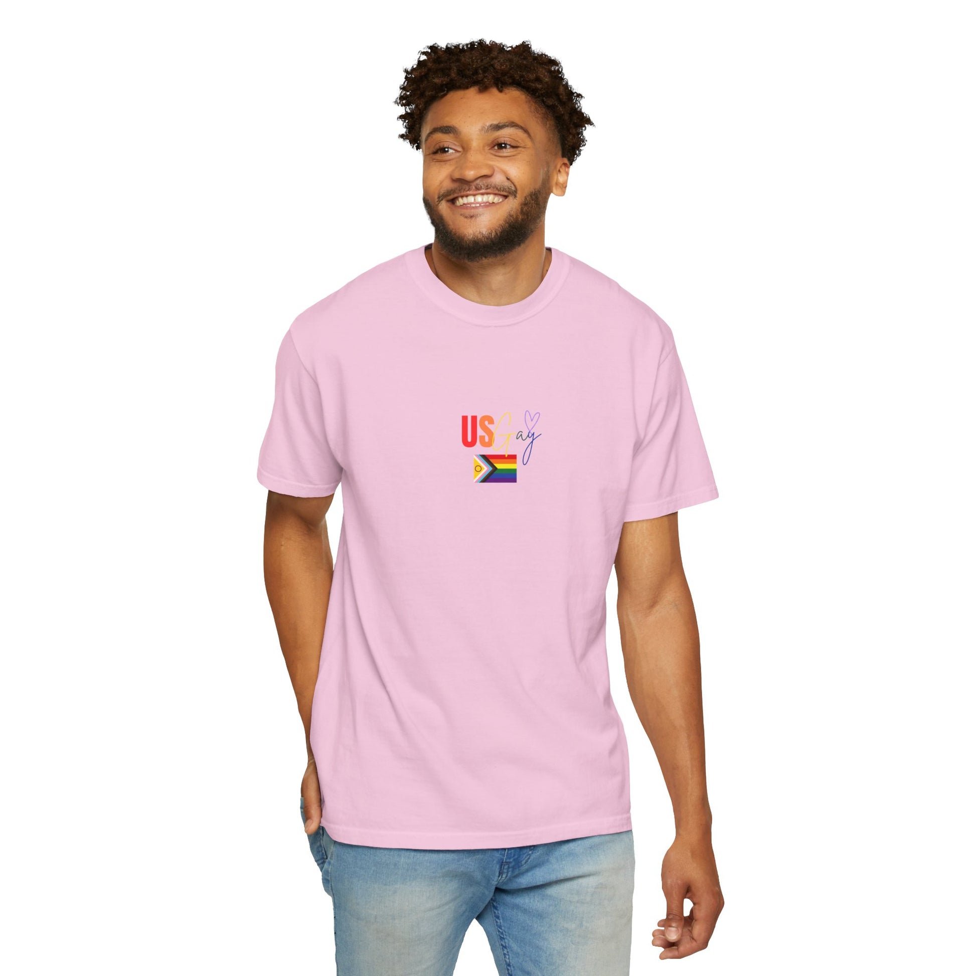 Soft pastel pink "US Gay" t-shirt with a colorful Pride flag, blending playful style with a strong LGBTQ+ statement.