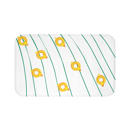 Plush bath mat with wavy river pattern and rubber ducky accents styled in college dorm bathroom