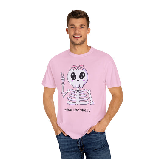 Pink Halloween tee with “What the Skelly” skeleton graphic, styled for playful spooky season fans.
