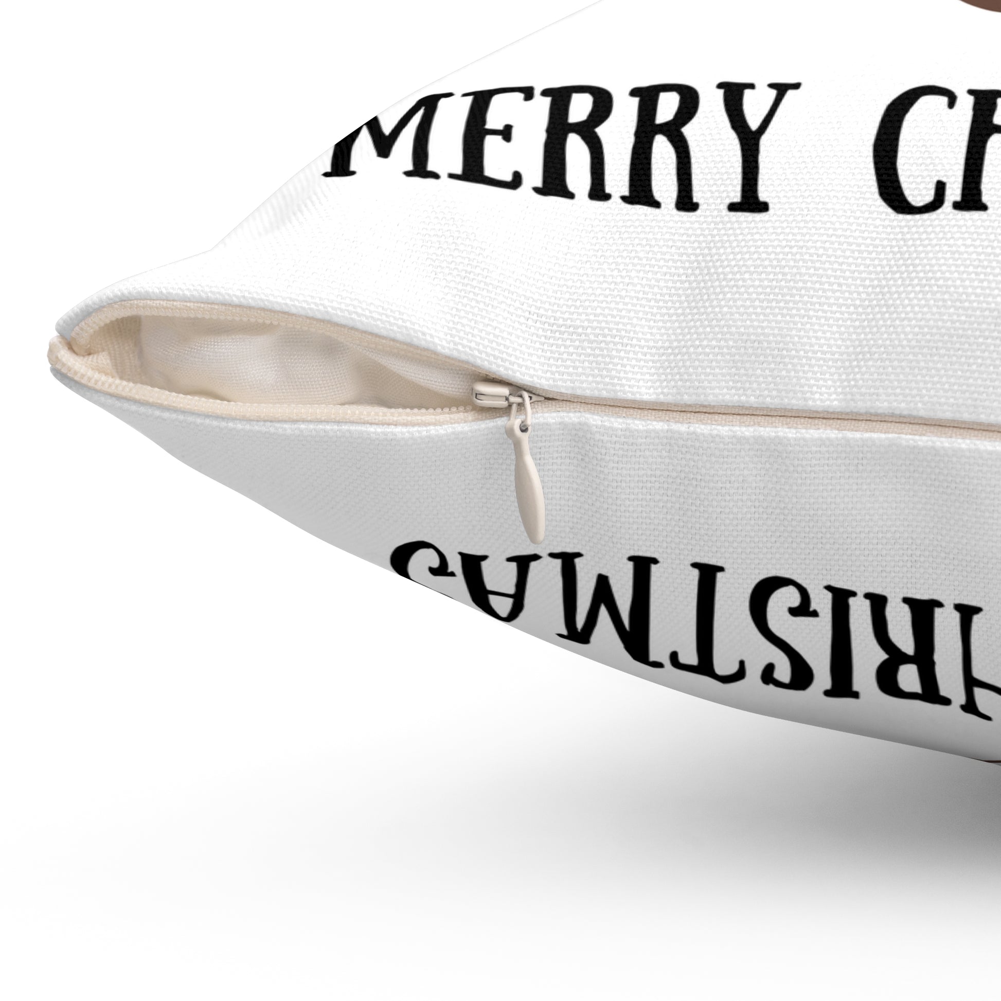 Close-up of hidden zipper on back of white holiday pillow with reindeer design showing neat stitching and cozy fabric texture