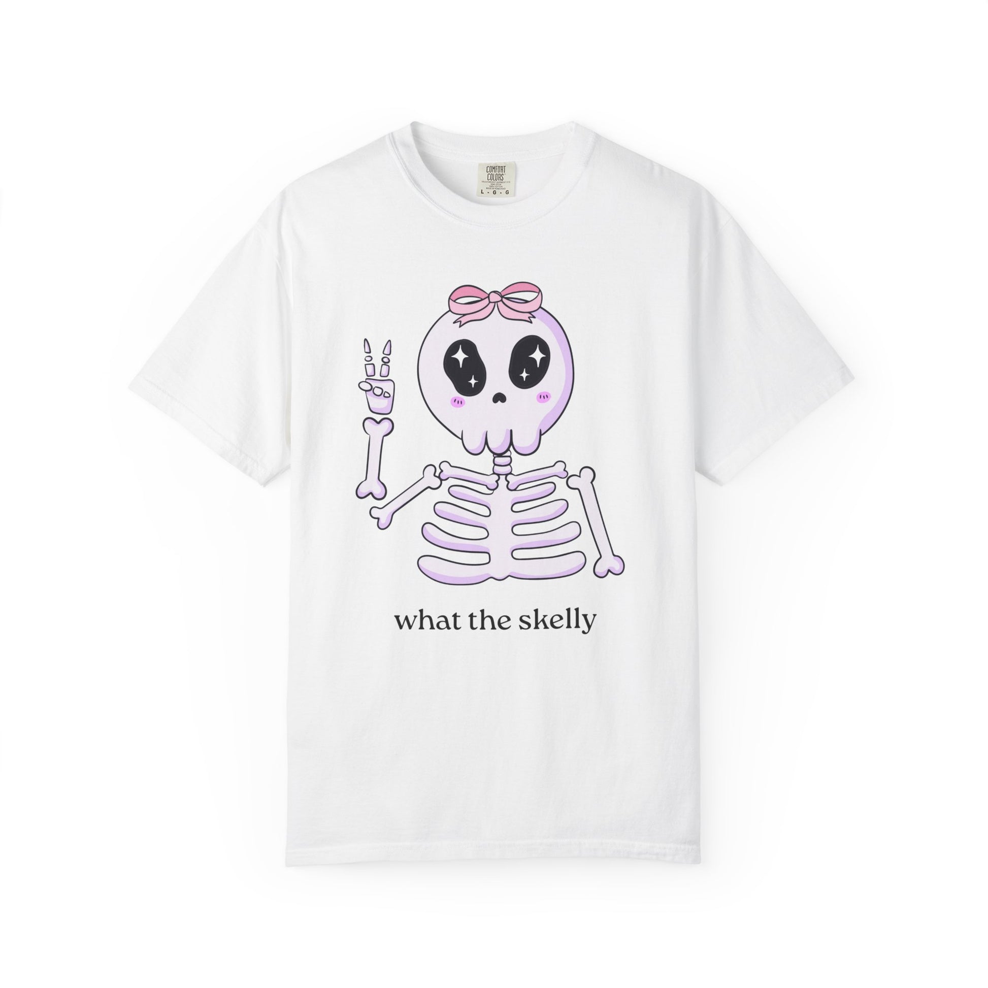 White Halloween tee with “What the Skelly” skeleton graphic, styled for cozy October vibes.