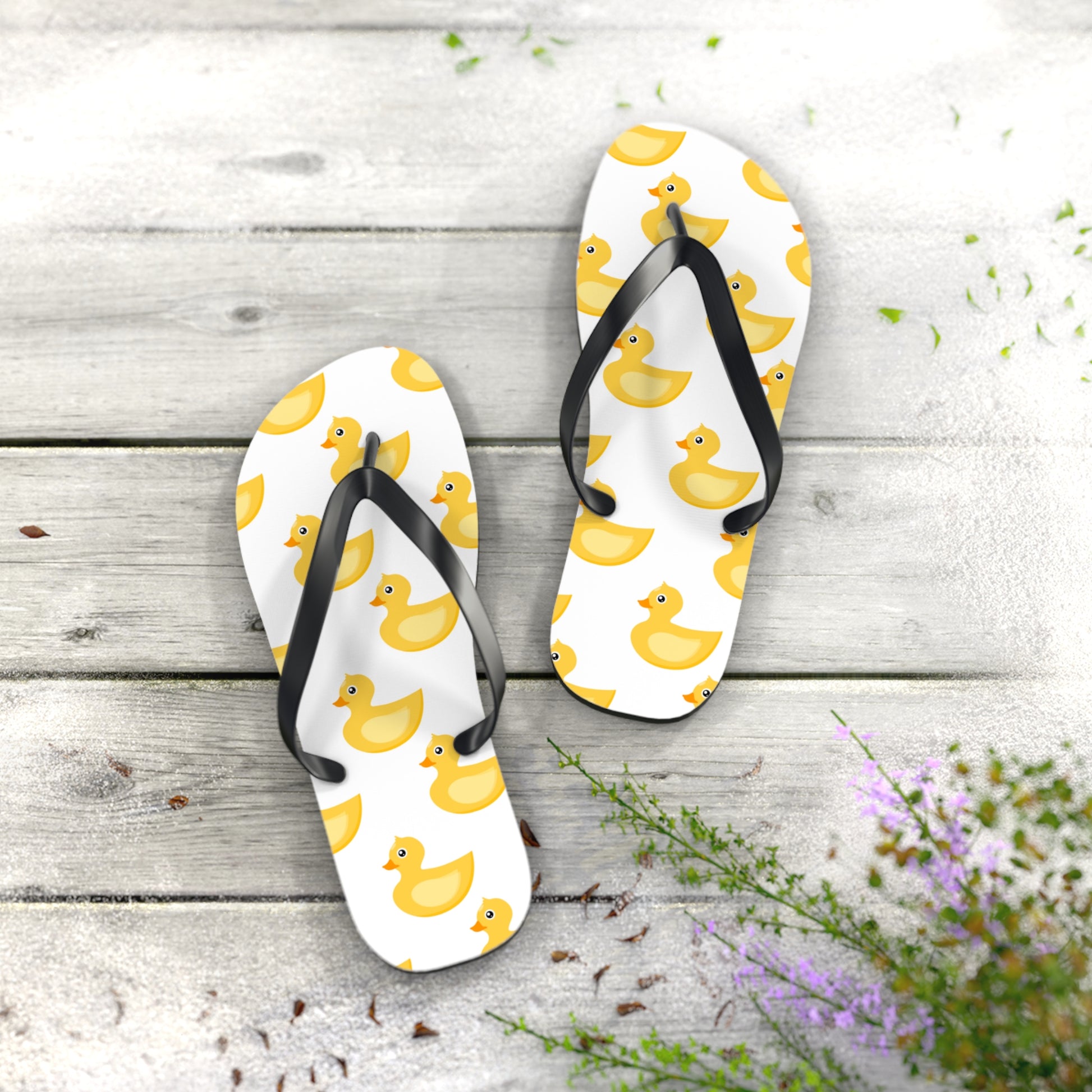 Close-up of Yellow Duck Flip-Flops showing vibrant duck pattern and cushioned footbed.