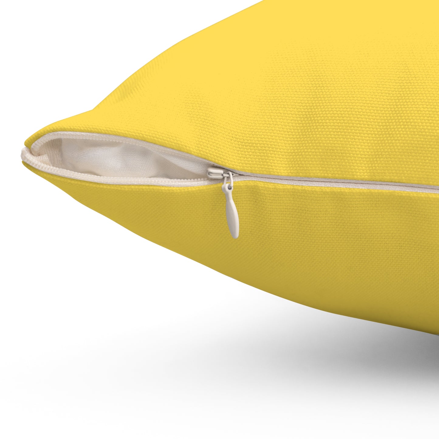 Modern yellow and green pillow adding cozy flair to minimalist college décor